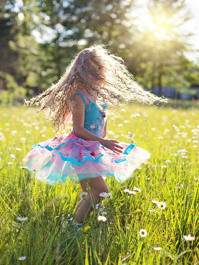 A child playing in a meadow